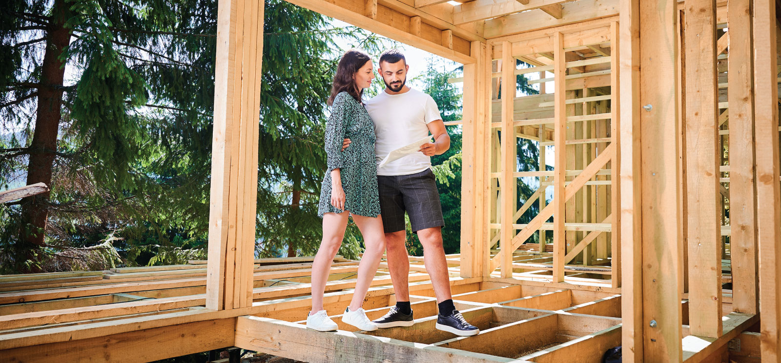 Couple in the middle of their new home being built.