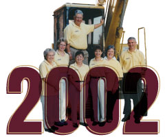 2002, photo of First Federal employees in front of an excavator