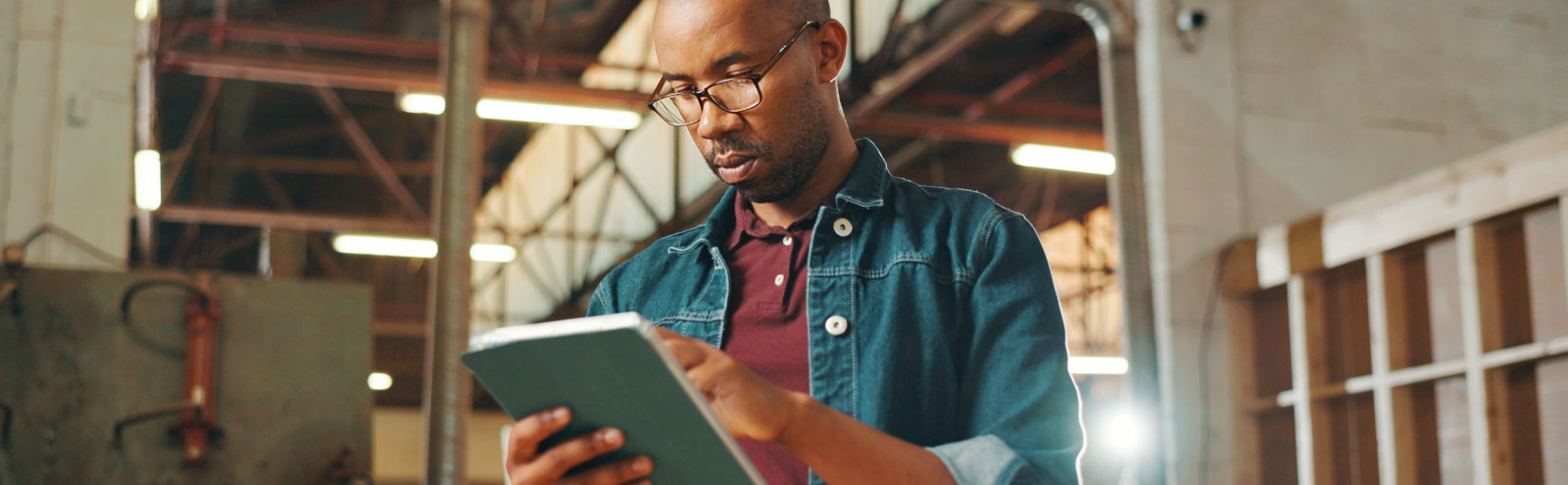 Carpenter looking at tablet.