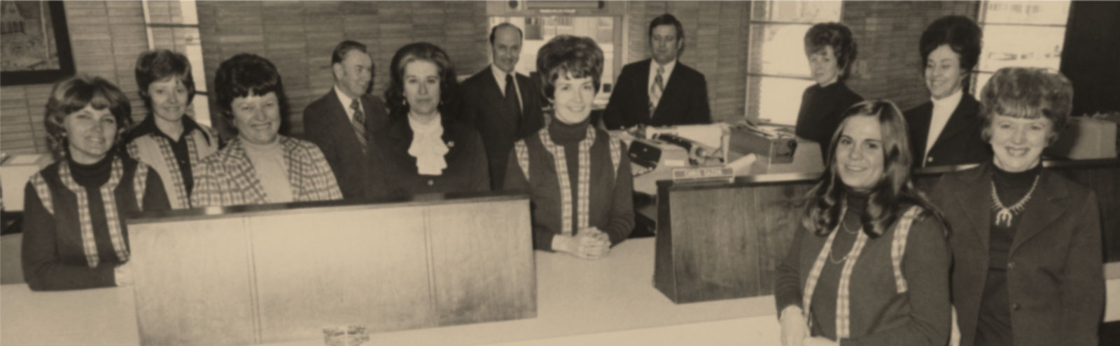 1970s photo of smiling First Federal tellers.