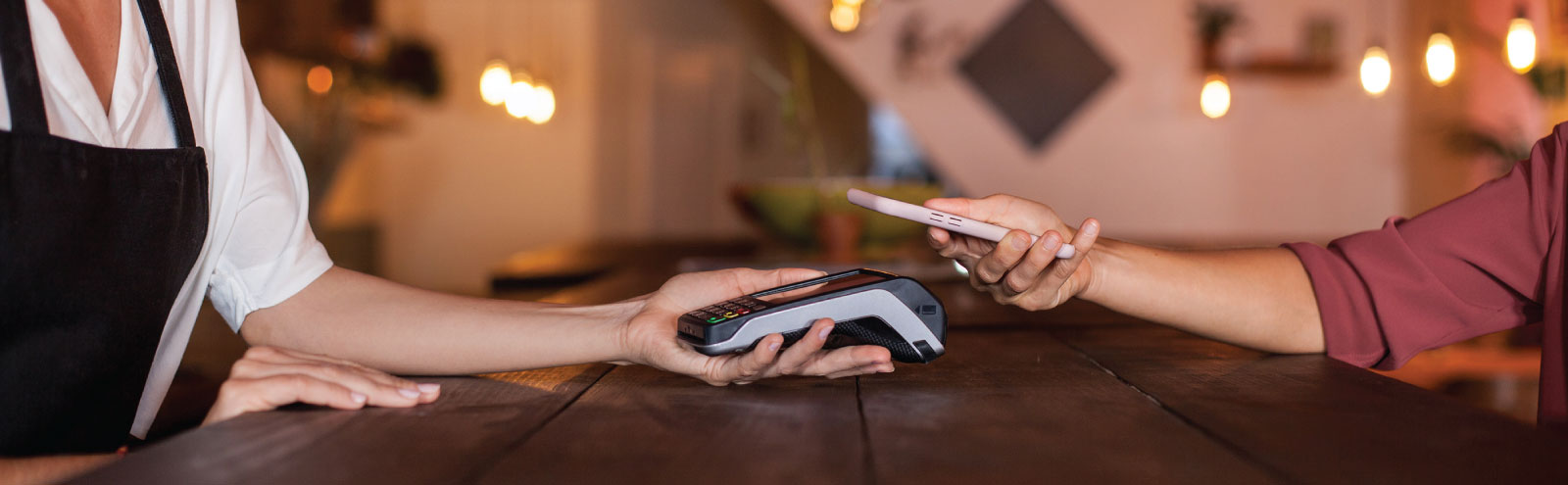 Customer paying with their phone at a restaurant