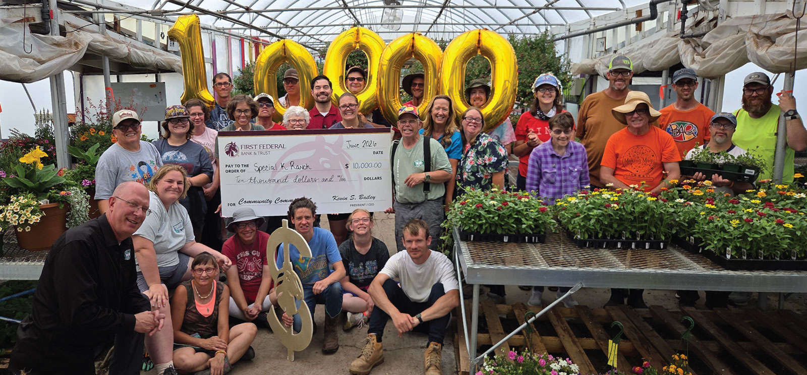 First Federal employees presenting $10,000 check to members of Special K Ranch.