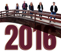 2016, photo of Billings employees on a red bridge